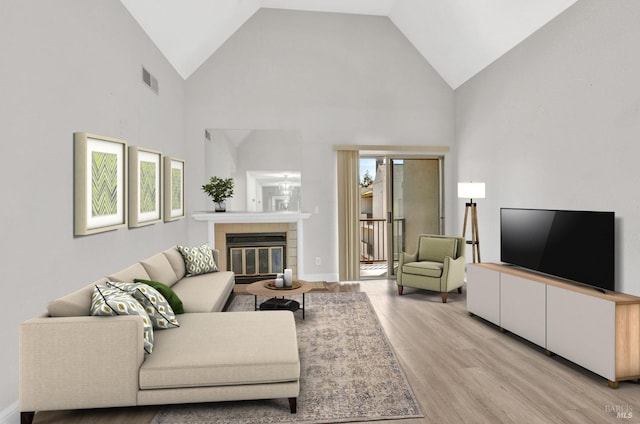 3183 Wayside Plz Unit 319, Walnut Creek, CA 94597 - living area with light wood-type flooring, high vaulted ceiling, and a fireplace