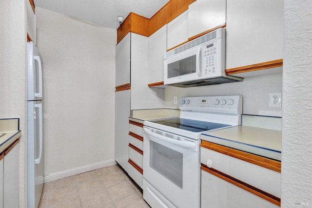 3183 Wayside Plz Unit 319, Walnut Creek, CA 94597 - kitchen featuring white appliances, light countertops, white cabinets, baseboards, and light tile patterned floors