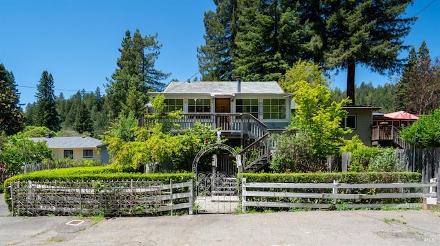 20226 Willow Rd, Monte Rio, CA 95462 - obstructed view of property with a fenced front yard and stairs