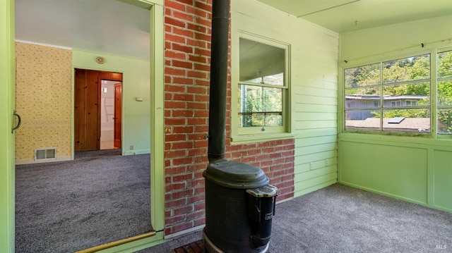 20226 Willow Rd, Monte Rio, CA 95462 - unfurnished sunroom featuring plenty of natural light and a wood stove