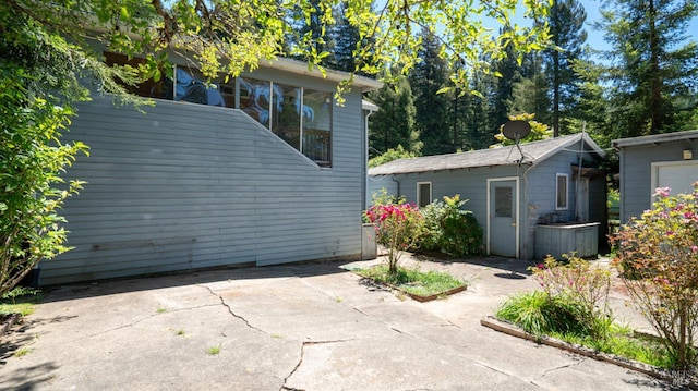 20226 Willow Rd, Monte Rio, CA 95462 - view of side of property featuring a patio area and an outdoor structure