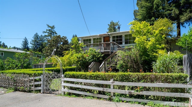 20226 Willow Rd, Monte Rio, CA 95462 - view of building exterior with a fenced front yard and stairway