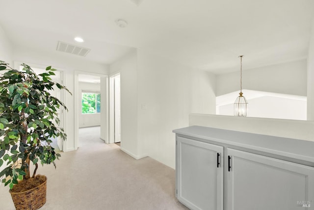 1917 Rollingwood Dr, Fairfield, CA 94534 - corridor with light colored carpet, baseboards, and an upstairs landing