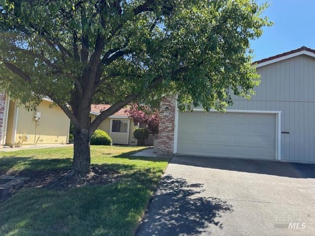 160 Bryce Way, Vacaville, CA 95687 - view of property hidden behind natural elements with a front lawn and driveway