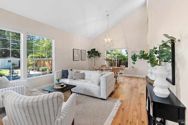 14 Ceriani Ct, Napa, CA 94558 - living room featuring healthy amount of natural light, a chandelier, baseboards, light wood finished floors, and high vaulted ceiling