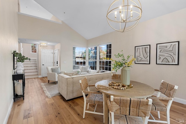 14 Ceriani Ct, Napa, CA 94558 - dining area featuring a chandelier, high vaulted ceiling, light wood-style flooring, and baseboards