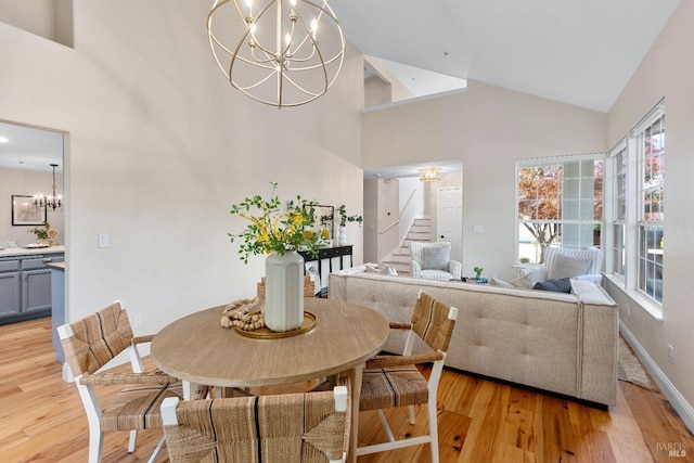 14 Ceriani Ct, Napa, CA 94558 - dining room with a chandelier, stairs, high vaulted ceiling, light wood finished floors, and baseboards