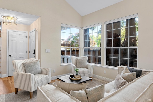 14 Ceriani Ct, Napa, CA 94558 - living area with lofted ceiling, wood finished floors, baseboards, and a chandelier