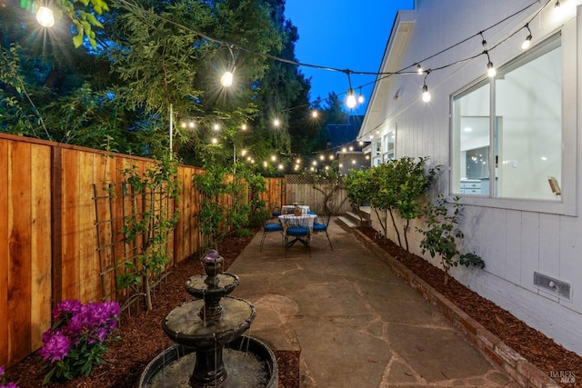14 Ceriani Ct, Napa, CA 94558 - patio at twilight featuring outdoor dining area and a fenced backyard