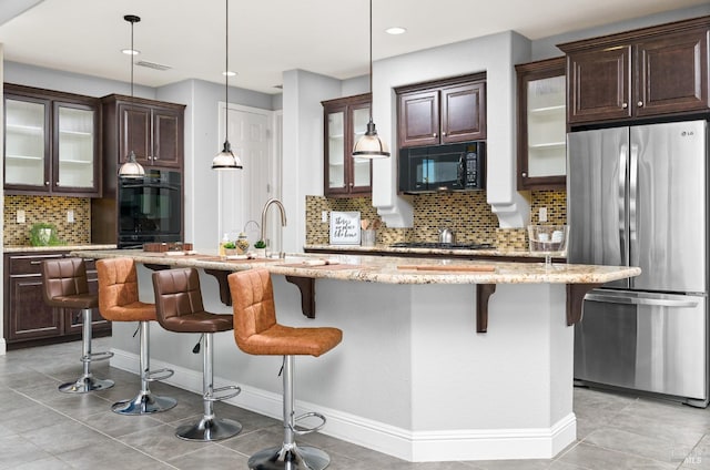 339 Desert Forest Ct, Rio Vista, CA 94571 - kitchen with black appliances, decorative backsplash, dark brown cabinetry, a sink, and recessed lighting