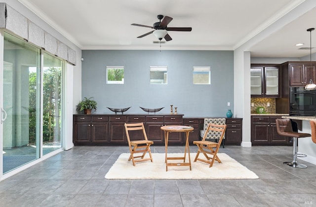 339 Desert Forest Ct, Rio Vista, CA 94571 - dining area featuring a ceiling fan, crown molding, and tile patterned flooring