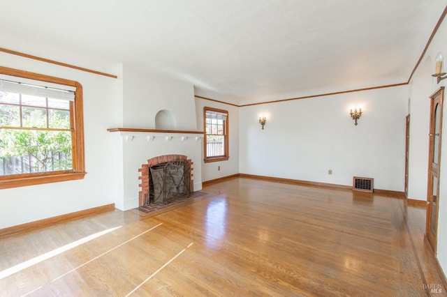 1124 Tuolumne St, Vallejo, CA 94590 - unfurnished living room featuring a fireplace, wood finished floors, baseboards, and crown molding