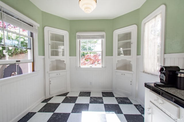1124 Tuolumne St, Vallejo, CA 94590 - dining space featuring a wainscoted wall and dark flooring