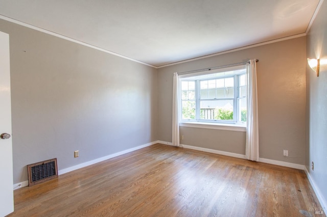 1124 Tuolumne St, Vallejo, CA 94590 - spare room featuring ornamental molding, wood finished floors, and baseboards