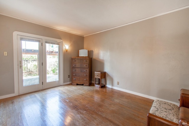 1124 Tuolumne St, Vallejo, CA 94590 - unfurnished bedroom with access to outside, wood finished floors, baseboards, and crown molding