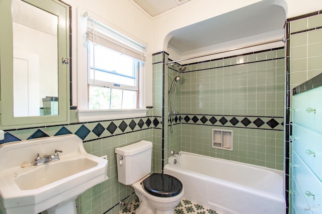 1124 Tuolumne St, Vallejo, CA 94590 - bathroom featuring a sink, toilet, tile walls, and bathtub / shower combination