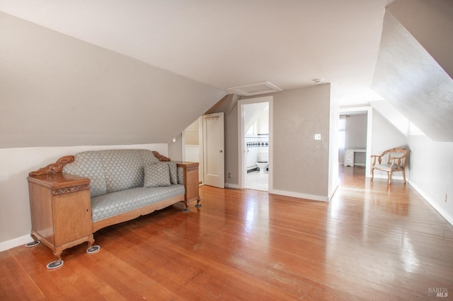 1124 Tuolumne St, Vallejo, CA 94590 - additional living space with lofted ceiling, wood finished floors, and baseboards
