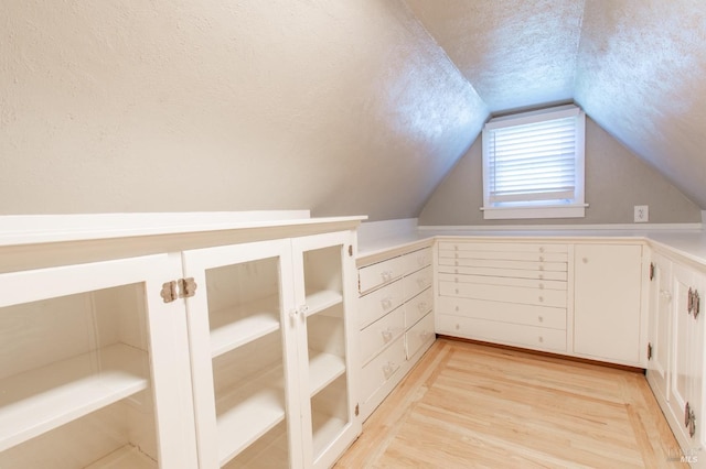 1124 Tuolumne St, Vallejo, CA 94590 - bonus room with a textured ceiling, light wood-type flooring, and vaulted ceiling