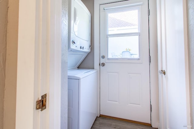 1124 Tuolumne St, Vallejo, CA 94590 - washroom with stacked washing machine and dryer and light wood-style floors