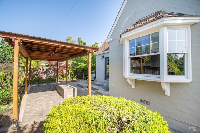 1124 Tuolumne St, Vallejo, CA 94590 - view of side of home featuring stucco siding, a patio area, and fence