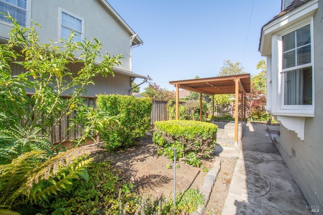 1124 Tuolumne St, Vallejo, CA 94590 - view of yard with fence, a patio, and a carport