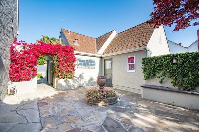 1124 Tuolumne St, Vallejo, CA 94590 - back of house featuring a patio area, stucco siding, a shingled roof, and fence