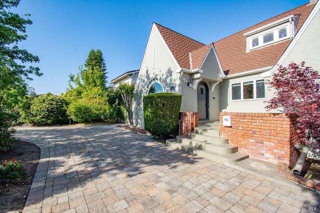 1124 Tuolumne St, Vallejo, CA 94590 - tudor home featuring stucco siding and roof with shingles