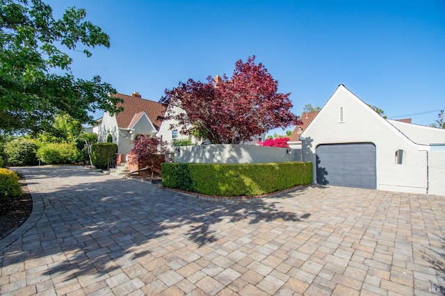 1124 Tuolumne St, Vallejo, CA 94590 - view of front facade with a garage, stucco siding, and decorative driveway