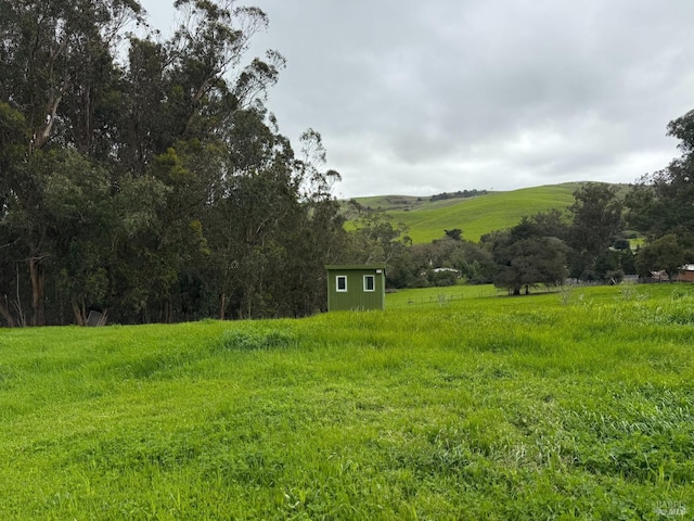 2499 Eastman Ln, Petaluma, CA 94952 - view of yard featuring an outbuilding, a storage unit, and a view of countryside