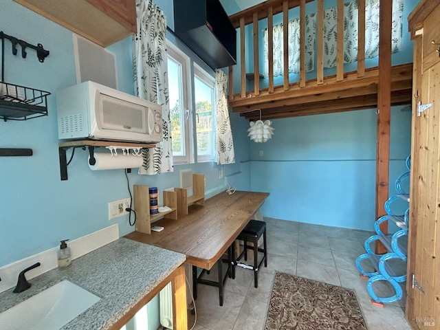 2499 Eastman Ln, Petaluma, CA 94952 - kitchen featuring a sink, light tile patterned flooring, and white microwave