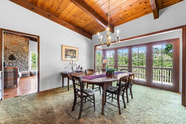 286 Monte Vista Dr, Napa, CA 94559 - carpeted dining space with wood ceiling with exposed beams, plenty of natural light, and a chandelier