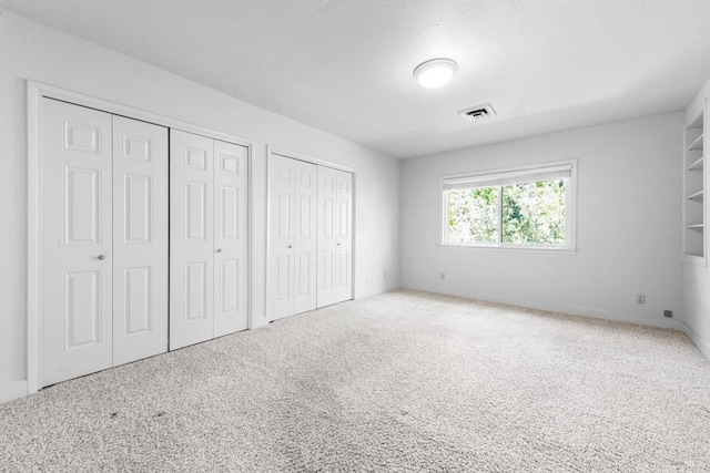 286 Monte Vista Dr, Napa, CA 94559 - unfurnished bedroom with two closets, carpet, and baseboards