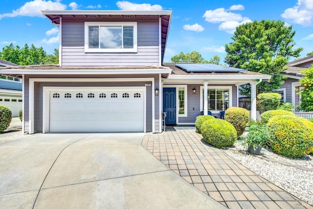 4564 Stillson St, Napa, CA 94558 - traditional-style house with driveway, an attached garage, roof mounted solar panels, and covered porch