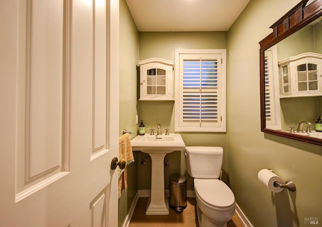 17 Oak Rd, Larkspur, CA 94939 - bathroom featuring baseboards, toilet, and wood finished floors