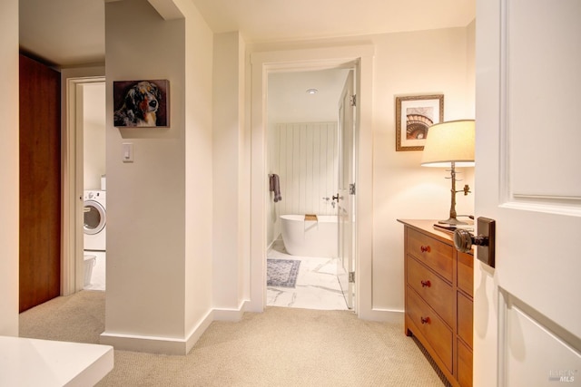 17 Oak Rd, Larkspur, CA 94939 - hallway with washer / clothes dryer, light colored carpet, and baseboards
