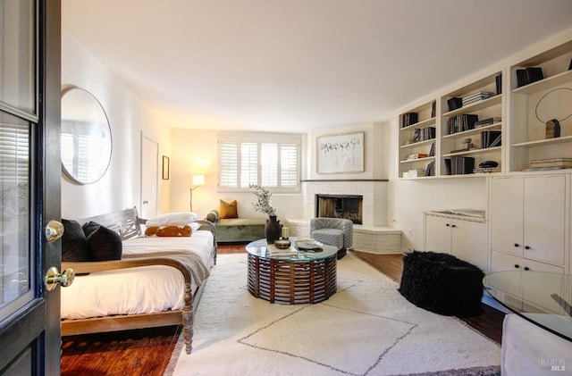 17 Oak Rd, Larkspur, CA 94939 - bedroom featuring a brick fireplace and wood finished floors