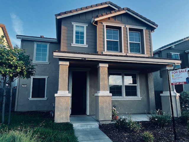 2560 Greg Jarvis Ave, Sacramento, CA 95834 - view of front of home with board and batten siding, stucco siding, and covered porch