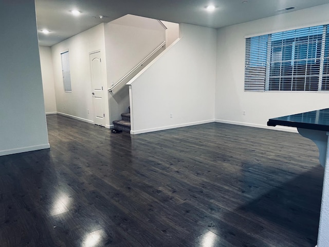 2560 Greg Jarvis Ave, Sacramento, CA 95834 - unfurnished living room featuring stairs, baseboards, dark wood finished floors, and recessed lighting