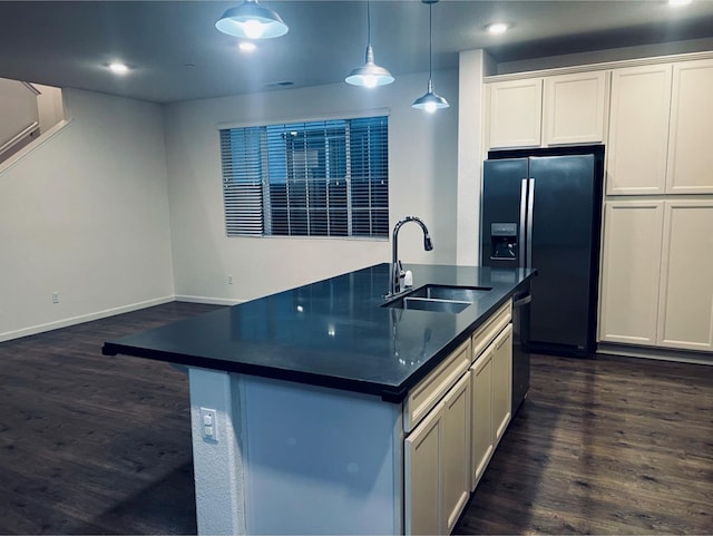 2560 Greg Jarvis Ave, Sacramento, CA 95834 - kitchen with a sink, dark countertops, black appliances, dark wood finished floors, and recessed lighting