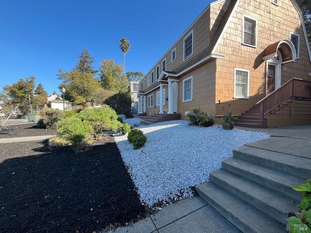 470 Wilson Ave, Vallejo, CA 94590 - view of side of home with a gambrel roof, roof with shingles, and a residential view
