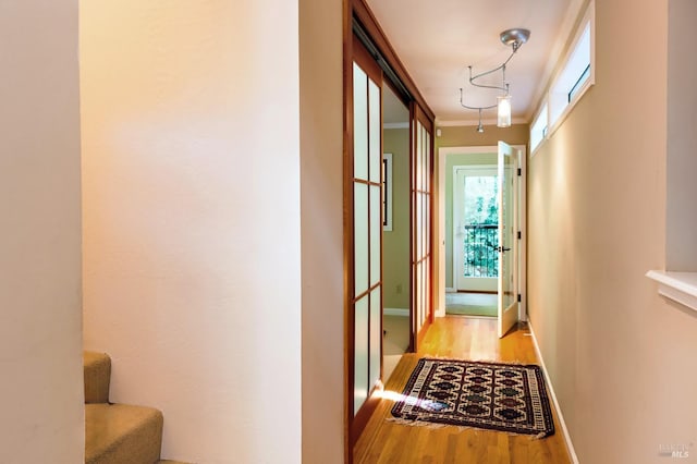 2859 Wallace Creek Rd, Healdsburg, CA 95448 - corridor featuring light wood-style flooring, plenty of natural light, ornamental molding, and baseboards