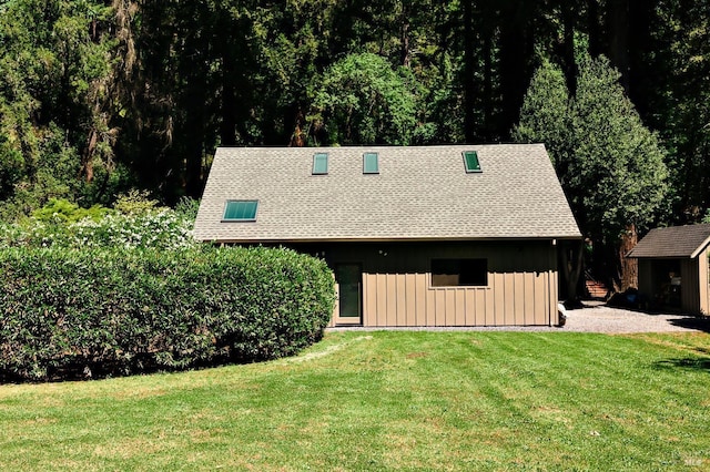 2859 Wallace Creek Rd, Healdsburg, CA 95448 - view of front facade with an outbuilding, a front yard, board and batten siding, roof with shingles, and a storage unit