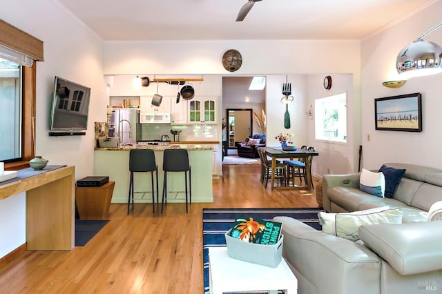 2859 Wallace Creek Rd, Healdsburg, CA 95448 - living room featuring light wood-style flooring, crown molding, and ceiling fan