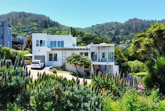 503 Easterby St, Sausalito, CA 94965 - back of property with a forest view, stucco siding, and a mountain view