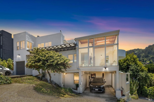 503 Easterby St, Sausalito, CA 94965 - contemporary house with stucco siding, a carport, concrete driveway, and an attached garage