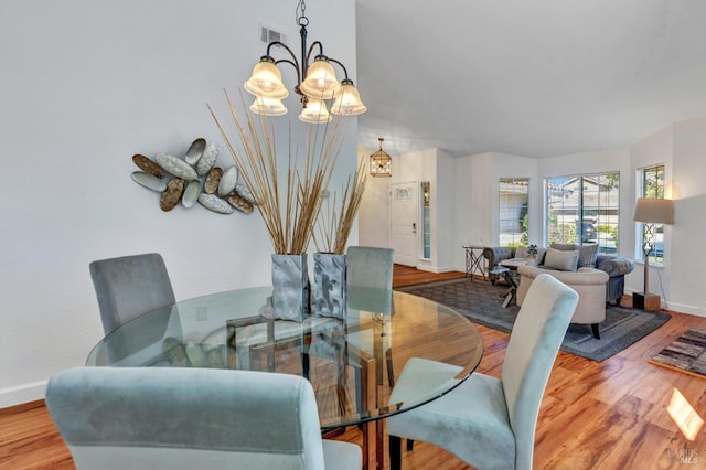 63 Brighton Dr, Vallejo, CA 94591 - dining room with a chandelier, baseboards, and wood finished floors