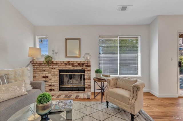 63 Brighton Dr, Vallejo, CA 94591 - living area featuring healthy amount of natural light, wood finished floors, a fireplace, and baseboards