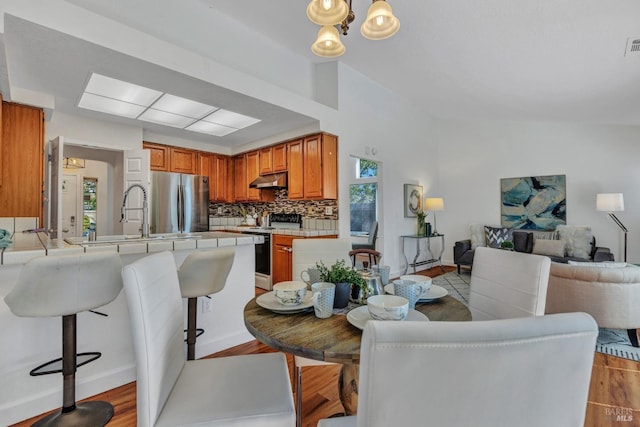 63 Brighton Dr, Vallejo, CA 94591 - dining room with light wood-type flooring, baseboards, and a chandelier