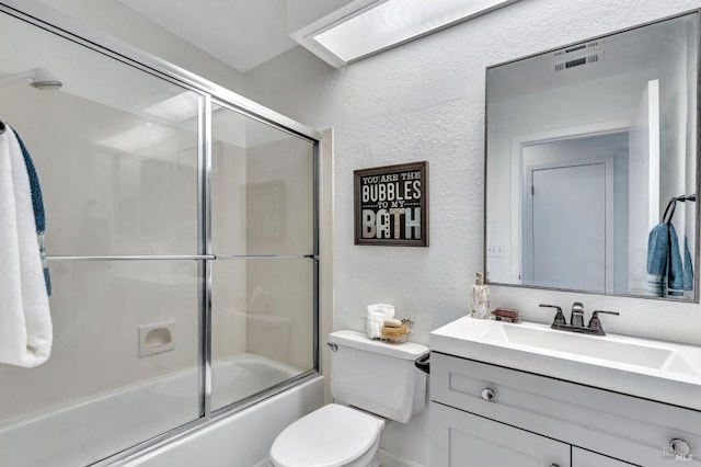 63 Brighton Dr, Vallejo, CA 94591 - full bathroom featuring a textured wall, vanity, toilet, and enclosed tub / shower combo