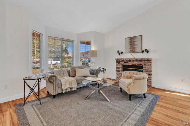 63 Brighton Dr, Vallejo, CA 94591 - living room with wood finished floors, a fireplace, baseboards, and vaulted ceiling